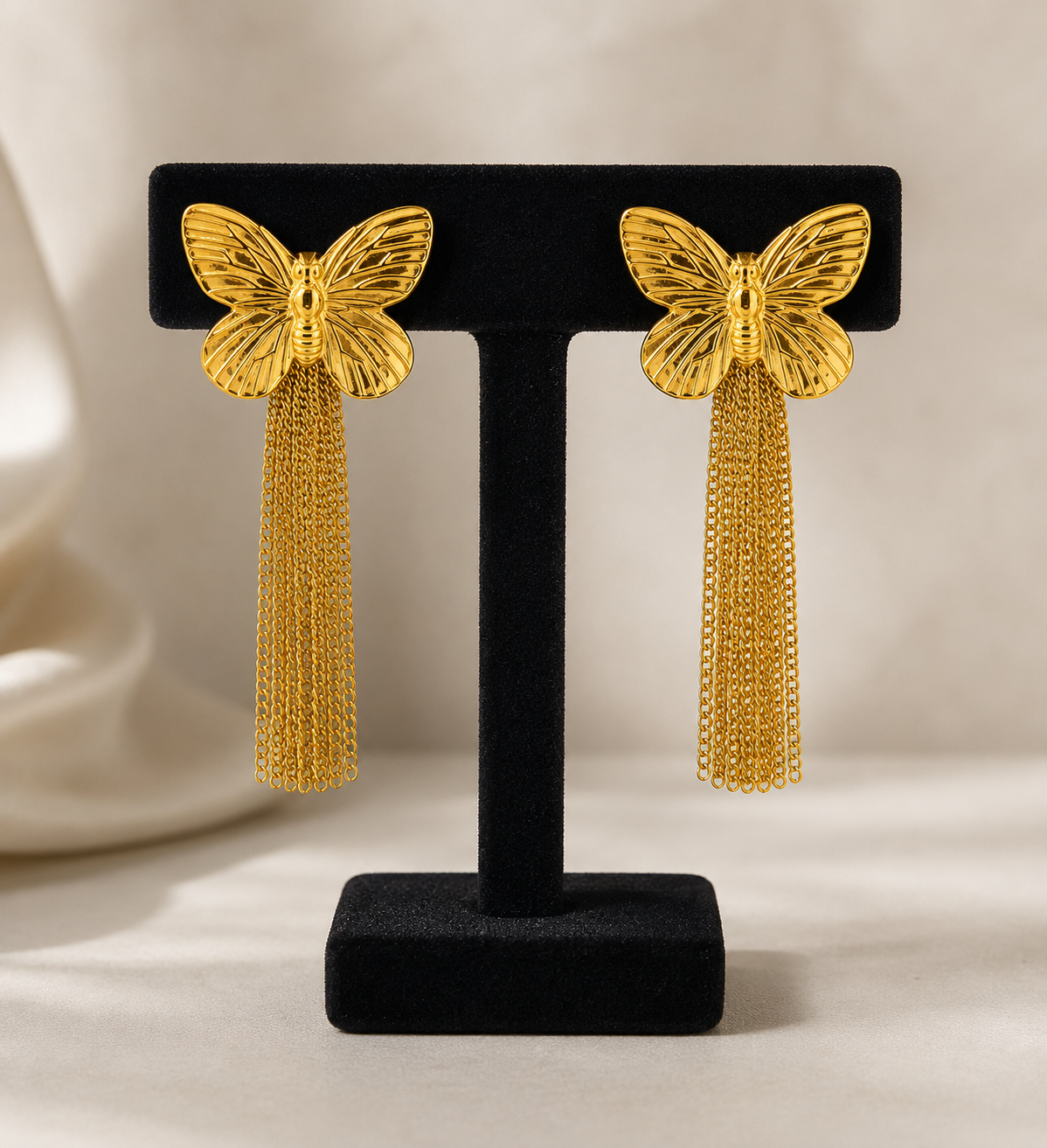 Golden tassel butterfly statement earrings